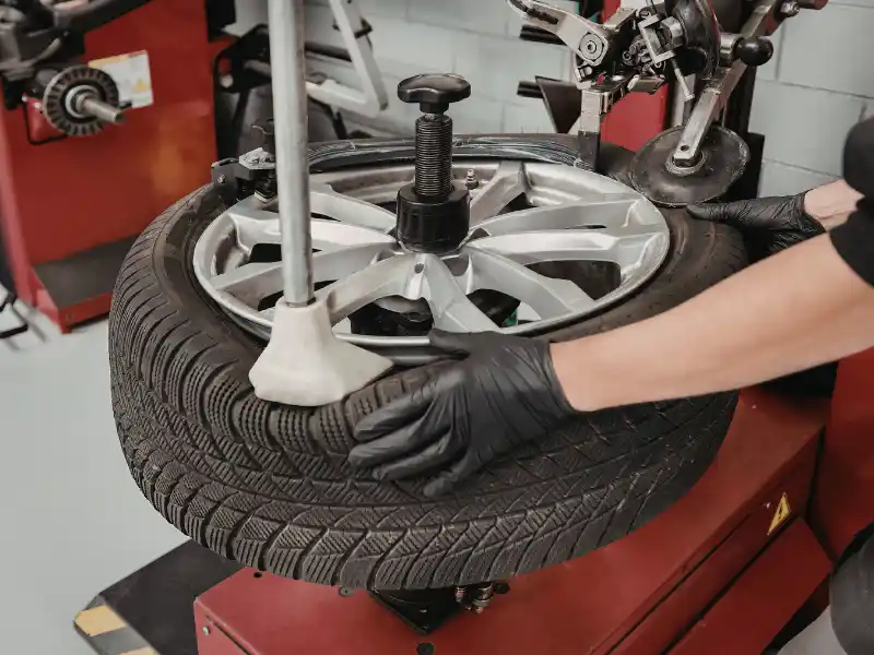 closeup of man working on a tyre